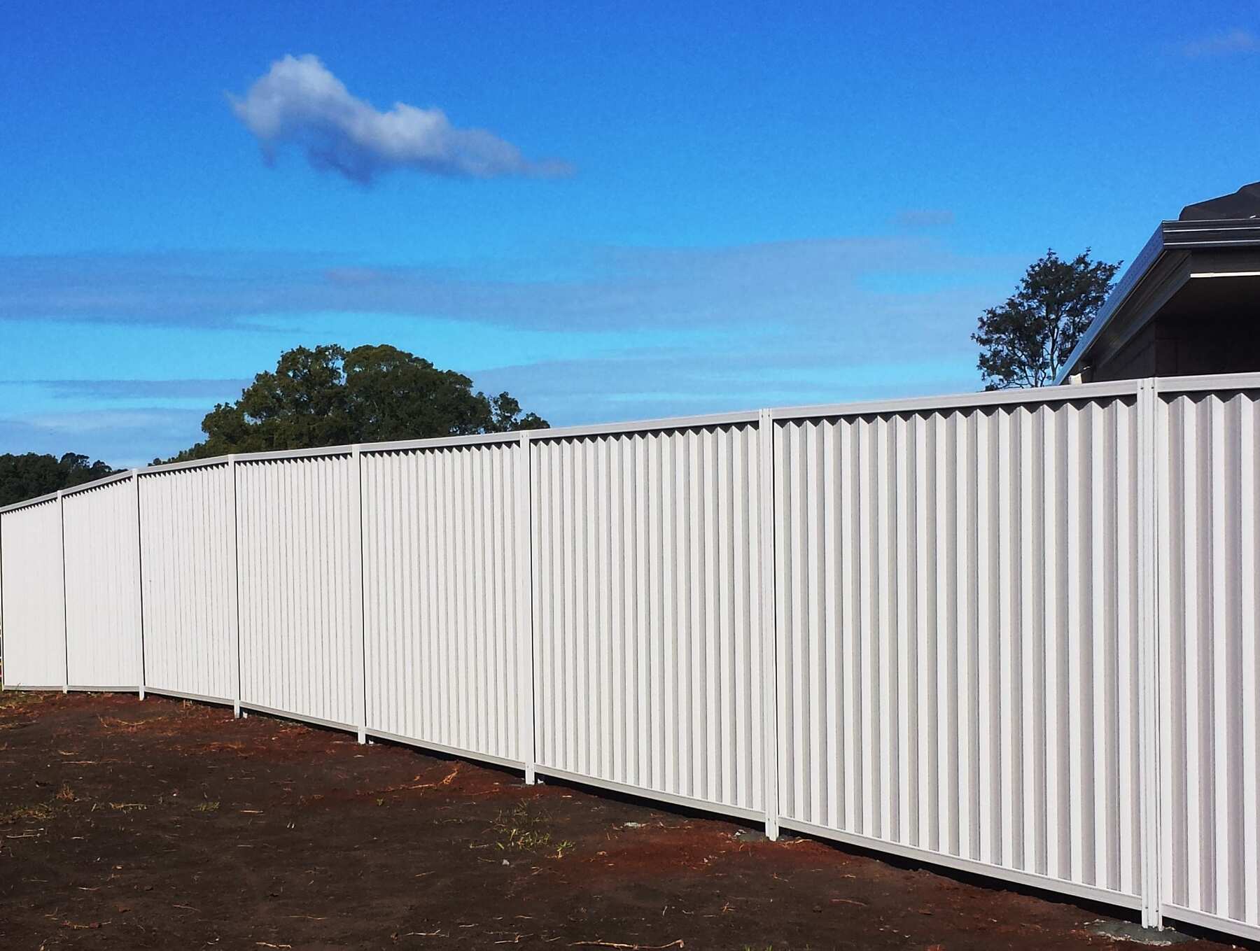 Colorbond fence raked to a slope in Surf Mist